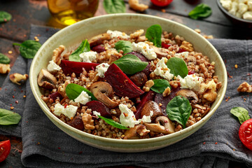 Buckwheat and beetroot salad with mushroom, walnut, spinach and feta cheese. healthy diet food