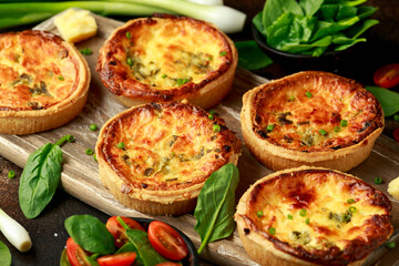 Cheddar cheese and spring onion omelette tarts served on wooden board with side salad. Healthy breakfast food - obrazy, fototapety, plakaty