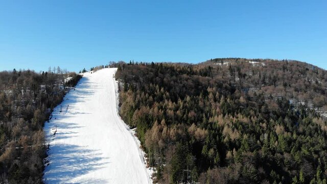 Ski piste and Jaworzyna Krynicka Mountain in winter. Krynica-Zdroj resort, Poland.