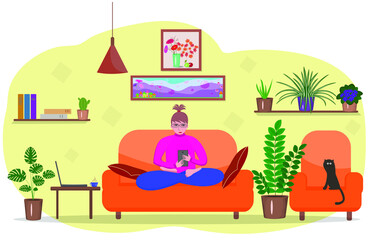Obraz na płótnie Canvas A girl with a smartphone on the sofa in the living room. Work at home. Interior of a living room with a sofa, potted flowers, a picture, a girl