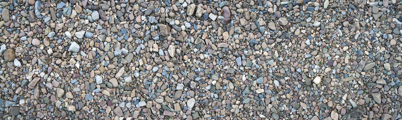 Dry river pebbles on the river Bank.