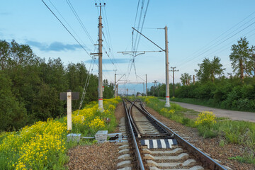 Railroad tracks by the countryside in the evening