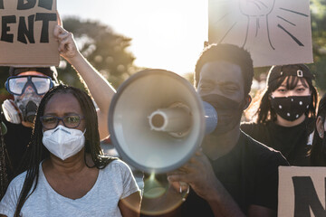 People from different culture and races protest on the street for equal rights - Demonstrators...