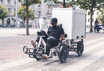 delivery man delivering post with special type of bicycle 