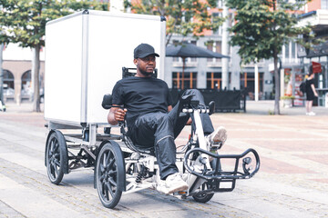 delivery man delivering post with special type of bicycle 