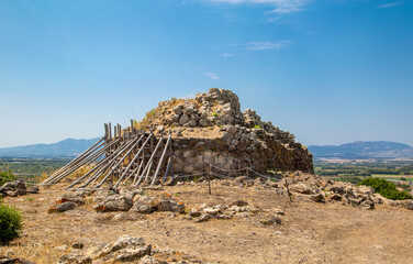 A nuraghe, an ancient megalithic edifice, in the nuragic sanctuary of Santa Cristina, near Oristano, Sardinia, Italy