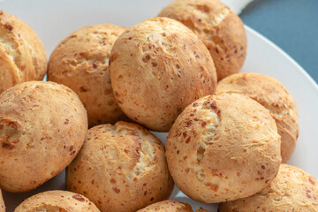 Fresh homemade cakes. Sweet rolls with a golden brown crust on baking paper