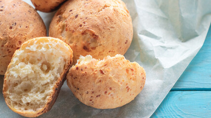Fresh homemade cakes. Sweet rolls with a golden brown crust on baking paper