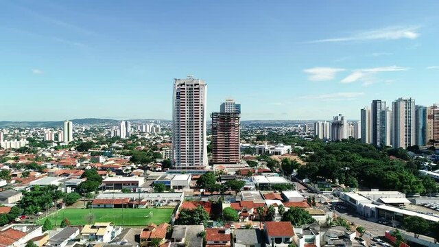 Aerial view of the city of Goi&acirc;nia, state of Goi&aacute;s, Brazil. City divided between an area full of buildings and others of residential houses. Concept of population growth increasing.