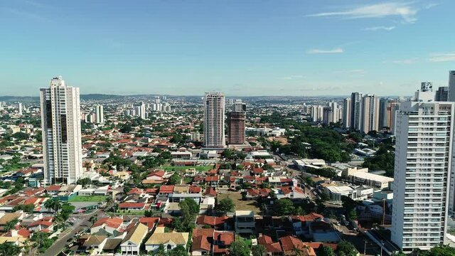 Aerial view of the city of Goi&acirc;nia, state of Goi&aacute;s, Brazil. City divided between an area full of buildings and others of residential houses. Concept of population growth increasing.