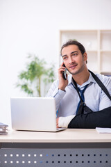 Fototapeta premium Injured male employee at workplace after accident