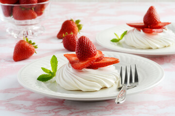 strawberry meringue nests with a fork