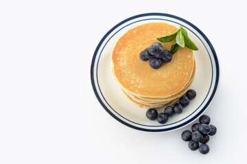 top view pancakes with blueberries on white