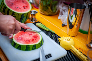 Man cut watermelon to slices