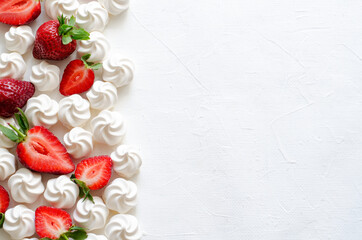 Pattern with strawberries and meringues on white background