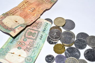 image of old Indian currency notes and coins.