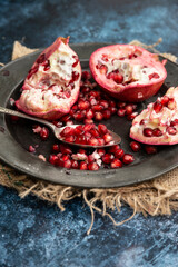 Beautiful food portrait of Pomegranate and seeds with old vintage texture background