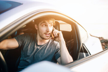 Trendy young men traveling by car. Relaxed happy man on summer roadtrip travel vacation