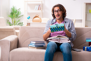 Young male student preparing for exams during Christmas