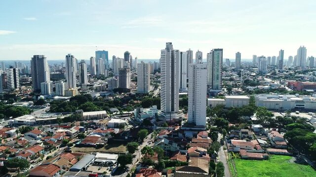 Aerial view of the city of Goi&acirc;nia, state of Goi&aacute;s, Brazil. City divided between an area full of buildings and others of residential houses. Concept of population growth increasing.