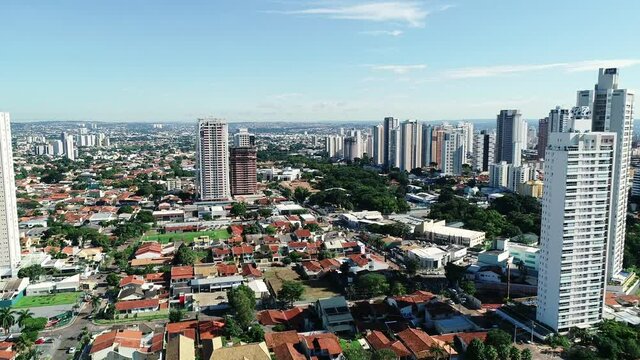 Aerial view of the city of Goi&acirc;nia, state of Goi&aacute;s, Brazil. City divided between an area full of buildings and others of residential houses. Concept of population growth increasing.