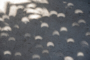 Shadow of solar eclipse on concrete floor .