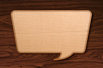 paper speech bubble on wooden background