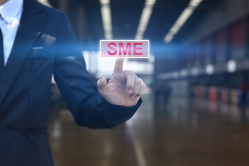Businessman hand pressing button SME icon. Concept of small and medium-sized enterprises business.