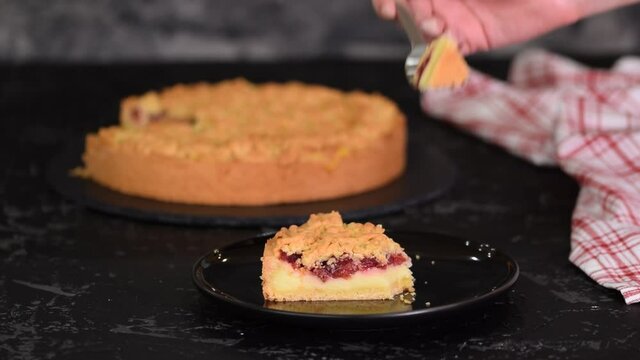 Piece of delicious cherry cake with shortcrust pastry and vanilla pudding.