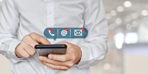 CONTACT US, Businessman hand holding mobile phone with ( address, phone, email ) icon. Concept of customer service call center.
