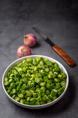chopped raw bhindi or okra in a bowl