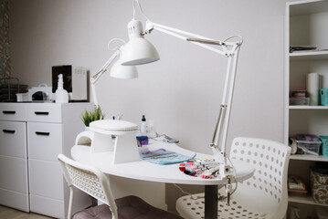 Beauty salon interior, no people. Manicure workplaces with professional tools