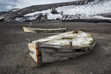 Old boat on the beach of Deception Island in Antarctica