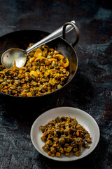 Indian cuisine  bhindi fry kept in a kadai or cooking pot to serve