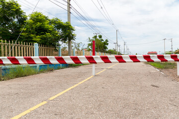 The barrier close the road. loses the passage for cars. Traffic forbidden road sign on a main road.Protected area, entrance is prohibited, passage