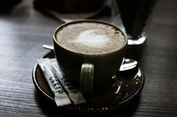 cup of coffee on black background