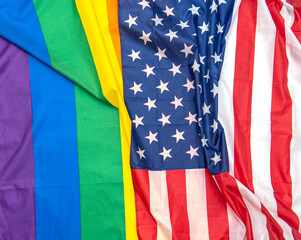 Fabric USA and gay pride rainbow flags as background, concept picture