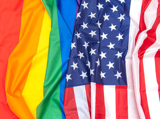 Fabric USA and gay pride rainbow flags as background, concept picture