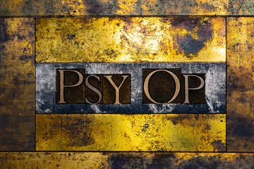 Psy Op text formed with real authentic typeset letters on vintage textured silver grunge copper and gold background