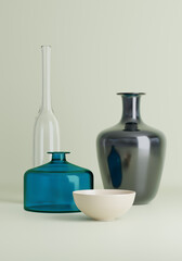 blue glass bottle and other tableware with reflection 3D CG illustration