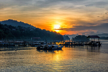 Beautiful landscape view of a jetty in Tengah beach during sunrise in Langkawi.Soft focus effect...