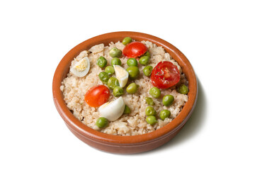 Cauliflower rice with peas, cherry tomatoes and quail eggs in a bowl.