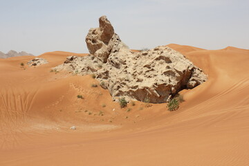 Hot and arid desert sand dunes terrain in Sharjah emirate in the United Arab Emirates. The oil-rich...