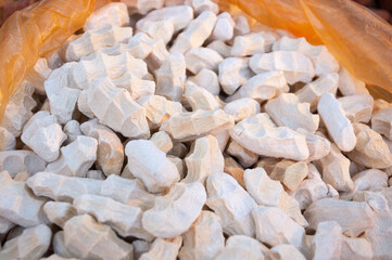 Assortment of Kashk, Qurut, Chortan, Qurt, Aaruul at the market, a type of hard cheese in Central...