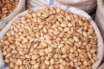 Raw almond nuts in the bag at Siab Bazaar in Samarkand, Uzbekistan, selective focus