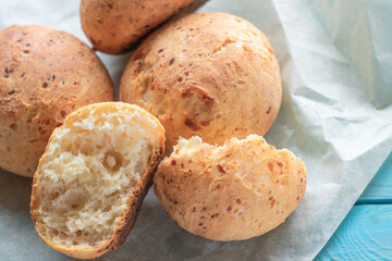 Fresh homemade cakes. Sweet rolls with a golden brown crust on baking paper