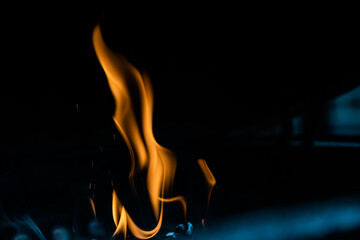 Flickering flame of a hot fire with an element of blue