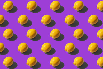 Yellow lemons on a purple background pattern