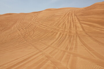 Hot and arid desert sand dunes terrain in Sharjah emirate in the United Arab Emirates. The oil-rich...