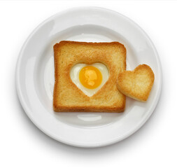 Egg in a hole of bread then toast that also known as egg in the basket.